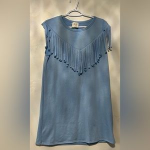 Short dress, no sleeves, has fringe on top. Super cute just didn’t fit me.